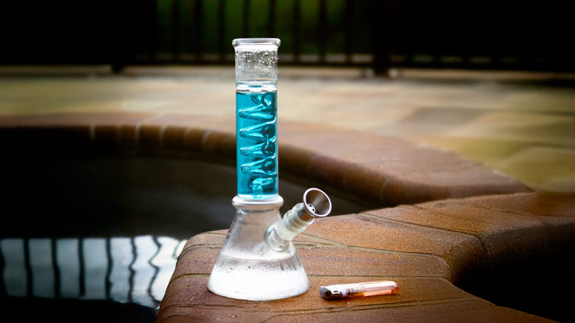 METTLE in use with a Cheech branded water pipe placed poolside